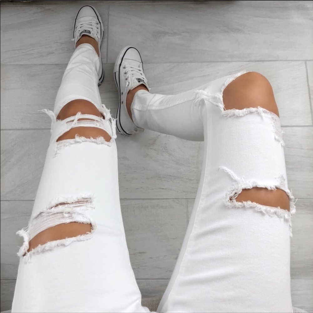 Distressed white jeans